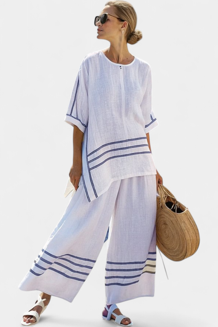 Vittorina – blusa asimétrica a rayas sofisticada y pantalones audaces