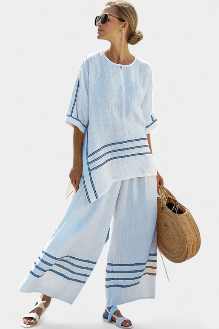 Vittorina – blusa asimétrica a rayas sofisticada y pantalones audaces