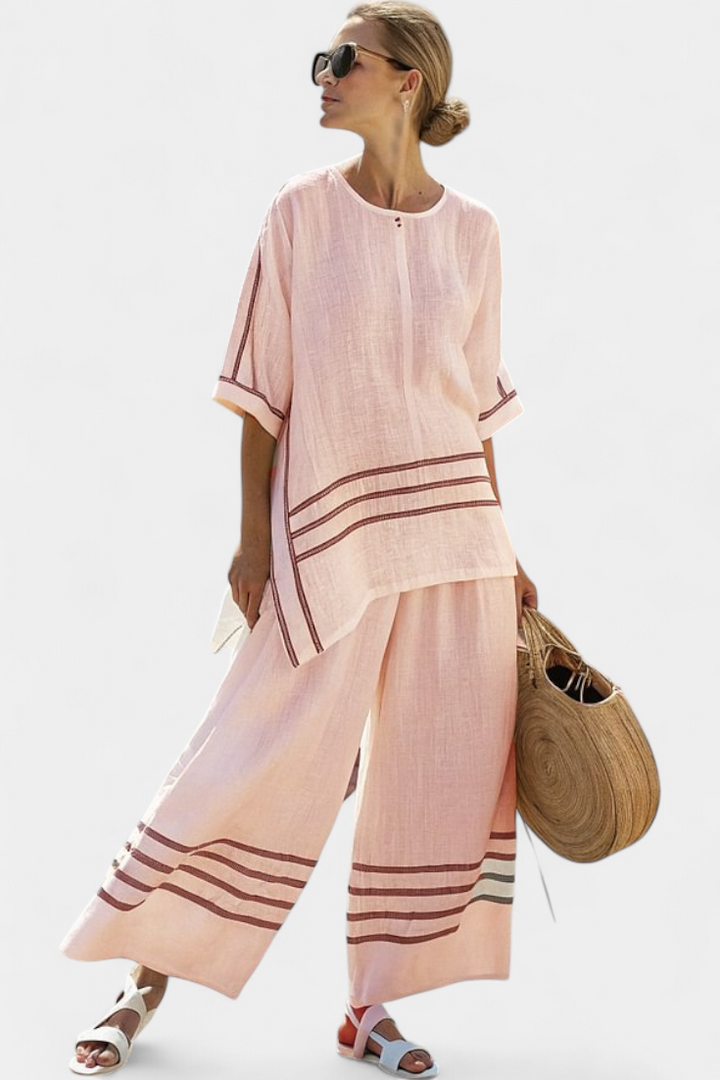 Vittorina – blusa asimétrica a rayas sofisticada y pantalones audaces