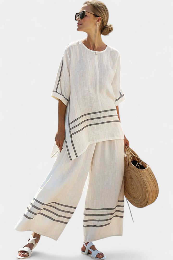 Vittorina – blusa asimétrica a rayas sofisticada y pantalones audaces