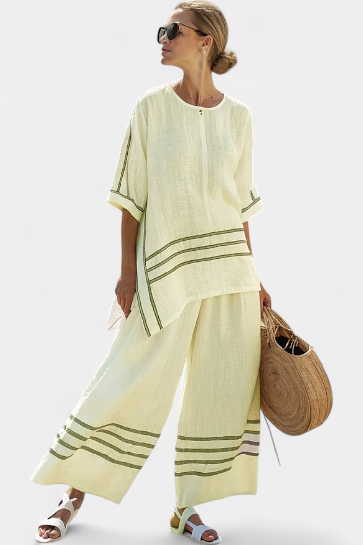 Vittorina – blusa asimétrica a rayas sofisticada y pantalones audaces